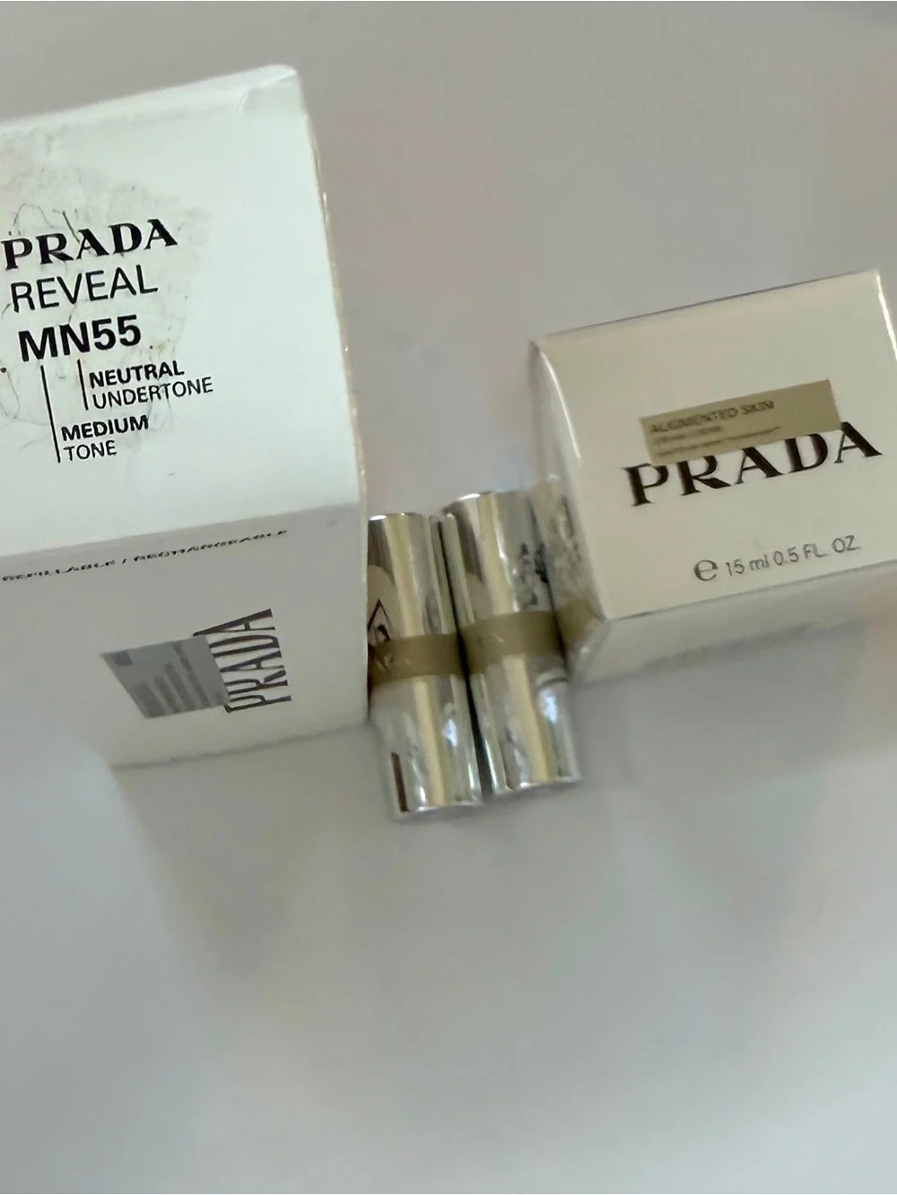 Prada Beauty Bundle NIB: Reveal Foundation, Augmented Skin Cream, 2 Banana balms